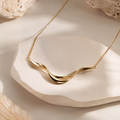 Varinoq™ Aurelia Sculptural Gold Wave Necklace